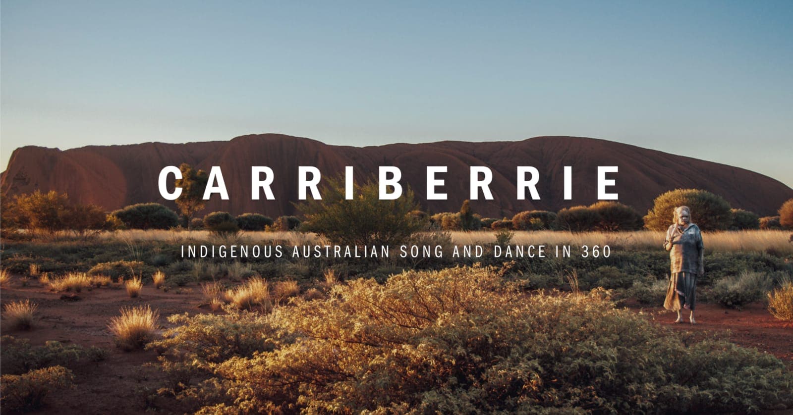 Carriberrie title card: a performer in ceremonial dress stands in red desert scrub before Uluru at sunset. Indigenous Australian song and dance in 360
