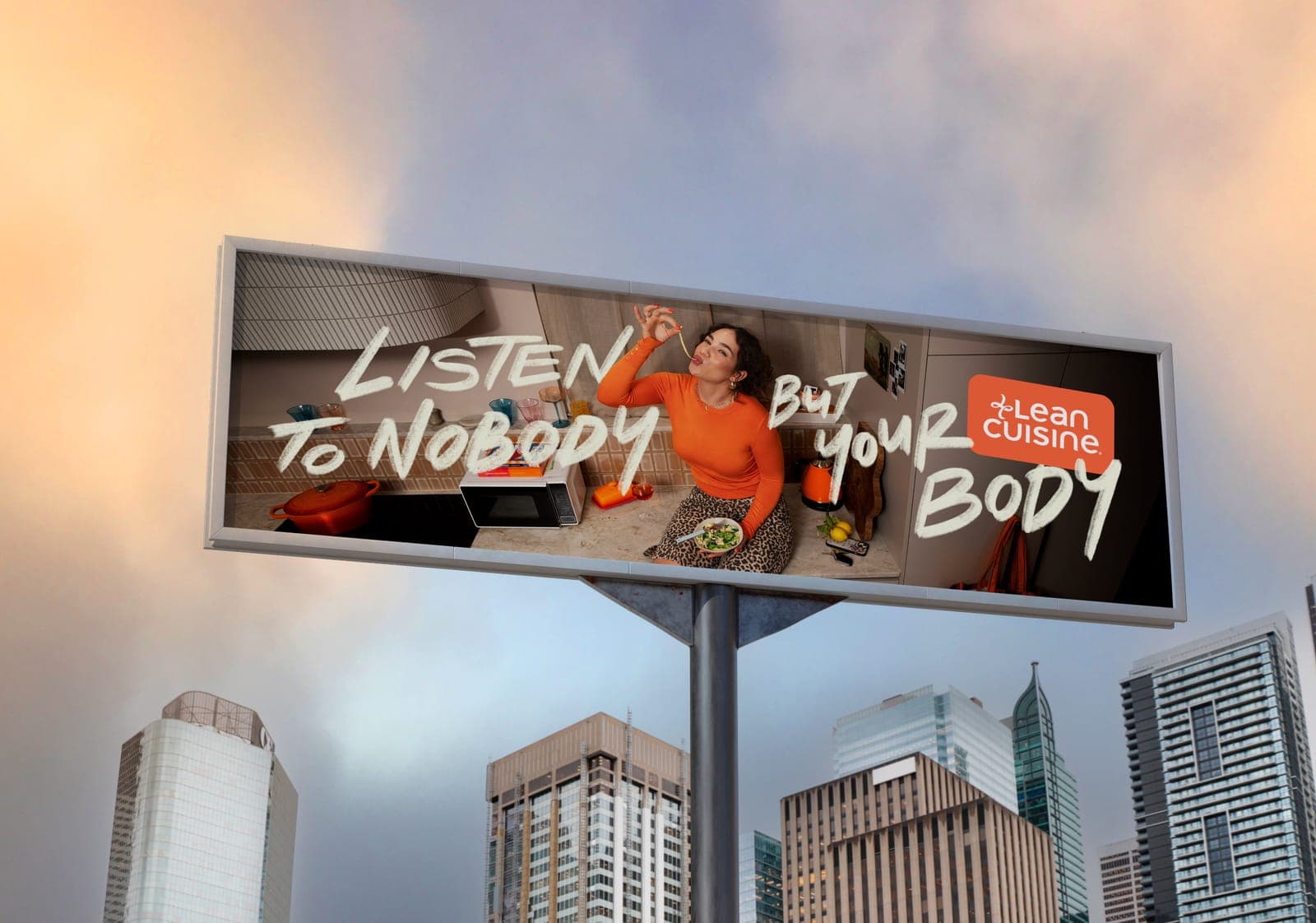 Listen to nobody but your body billboard for Lean Cuisine above a city street