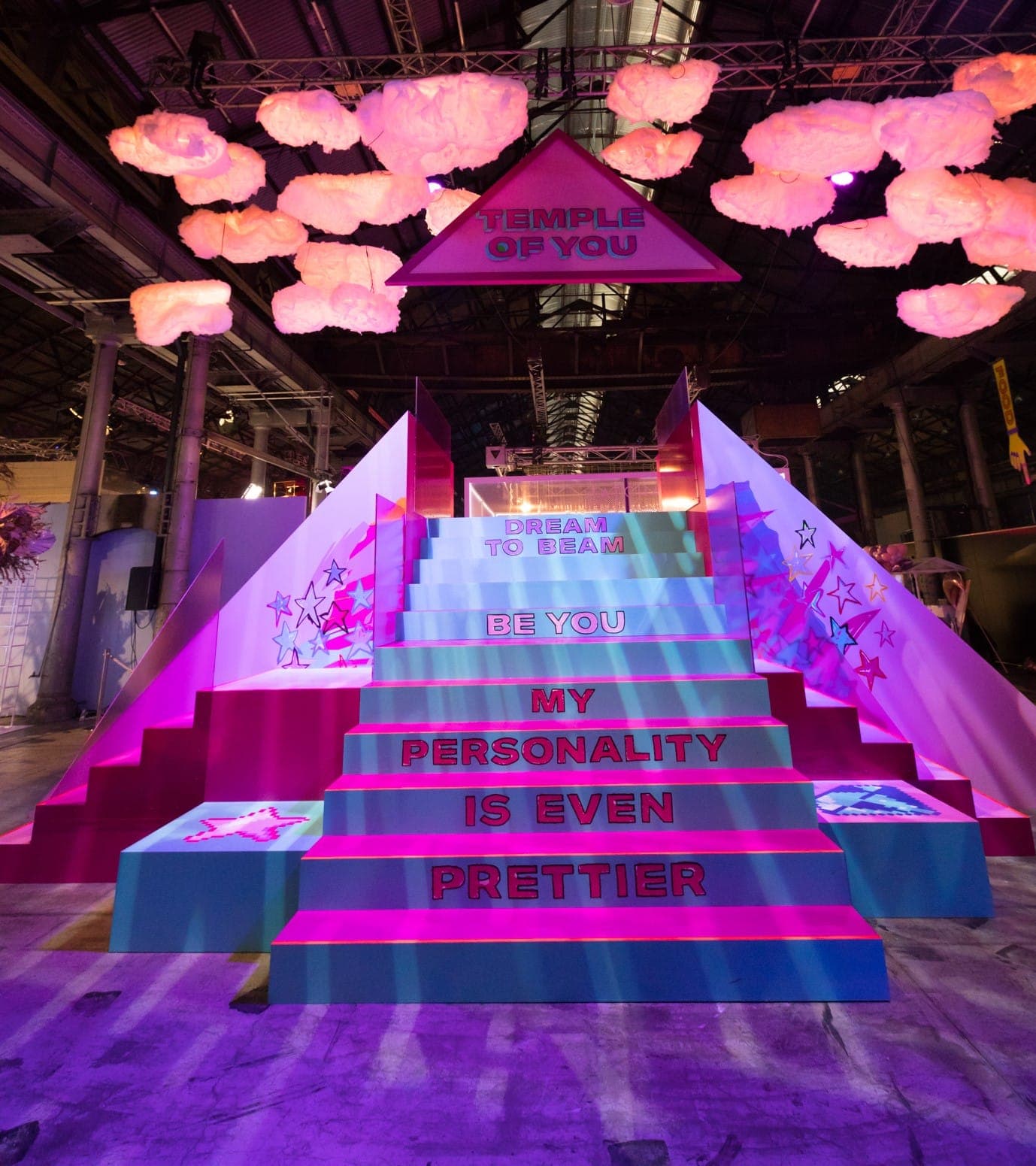 The Temple of You staircase, its steps reading Dream to beam, Be you, My personality is even prettier
